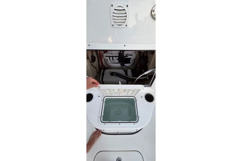 Slide: The Image of 2021 Sea Pro 228 Bay boat interior showing storage compartment and livewell. - 30