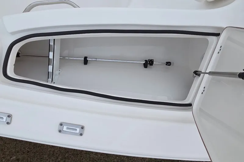 Slide: The Image of 2021 Sea Pro 228 Bay boat storage compartment, open and empty. - 32
