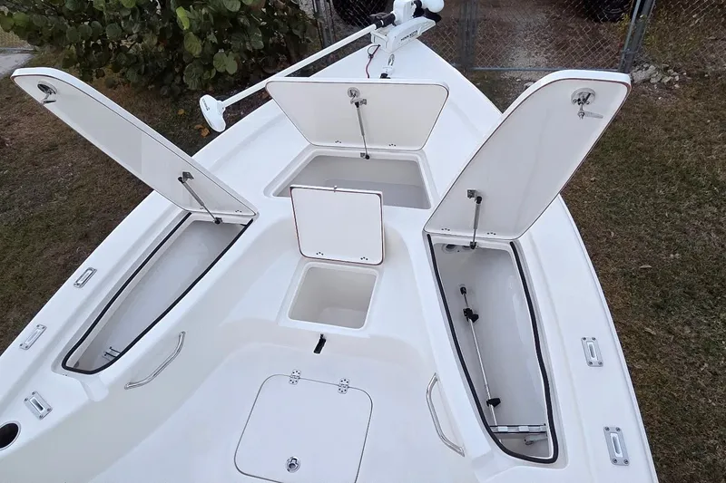 Slide: The Image of 2021 Sea Pro 228 Bay boat with open storage compartments on deck. - 27