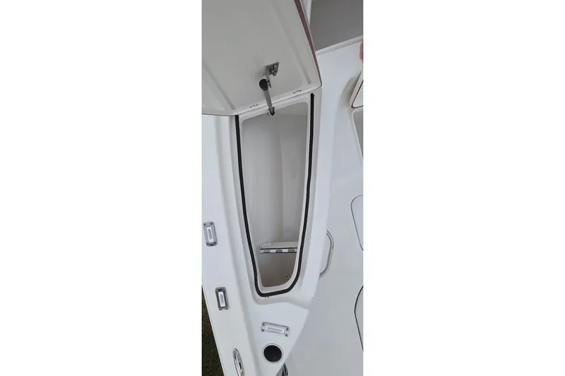 Slide: The Image of Open storage compartment on a 2021 Sea Pro 228 Bay boat. - 31