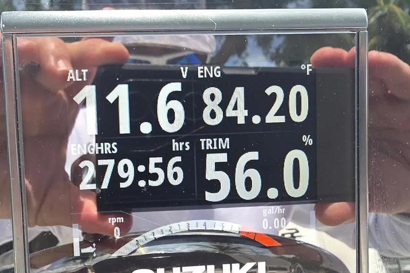 Slide: The Image of Digital display on a 2021 Sea Pro 228 Bay boat showing engine stats and temperature. - 18