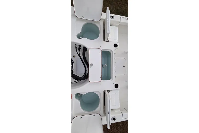 Slide: The Image of 2021 Sea Pro 228 Bay boat interior with storage compartments and livewells. - 33