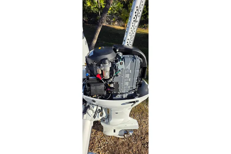 Slide: The Image of 2021 Sea Pro 228 Bay boat engine, detailed view of motor components. - 26