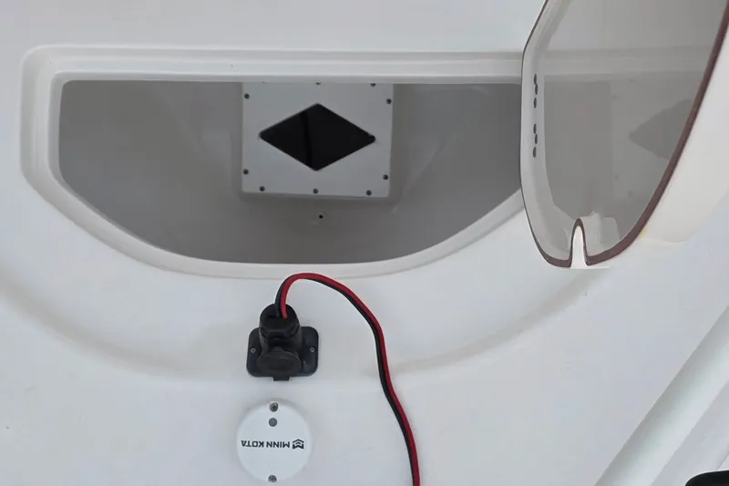 Slide: The Image of 2021 Sea Pro 228 Bay boat compartment with wiring and Minn Kota accessory. - 29