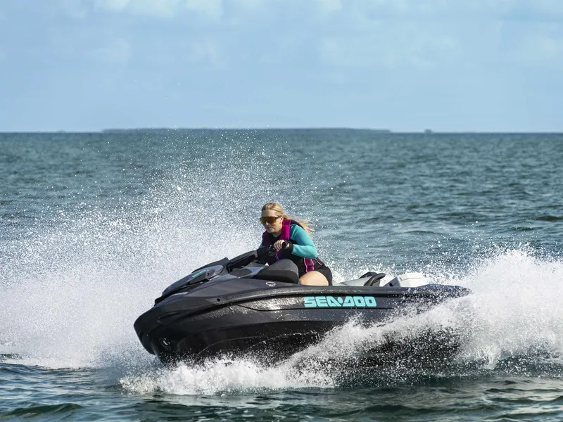 Slide: The Image of A person rides a Sea-Doo GTR 230 jet ski on the sea, splashing water. - 10