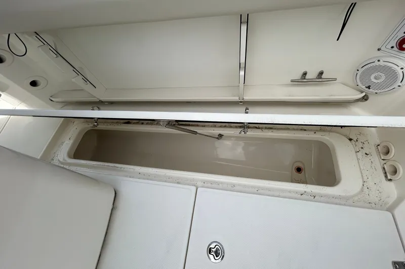 Slide: The Image of Open storage compartment on a 2020 Boston Whaler 280 Outrage boat, showcasing interior details. - 19