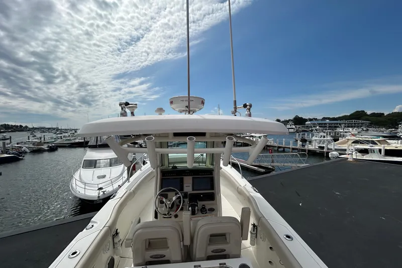 Slide: The Image of 2020 Boston Whaler 280 Outrage boat docked at marina under blue sky. - 20