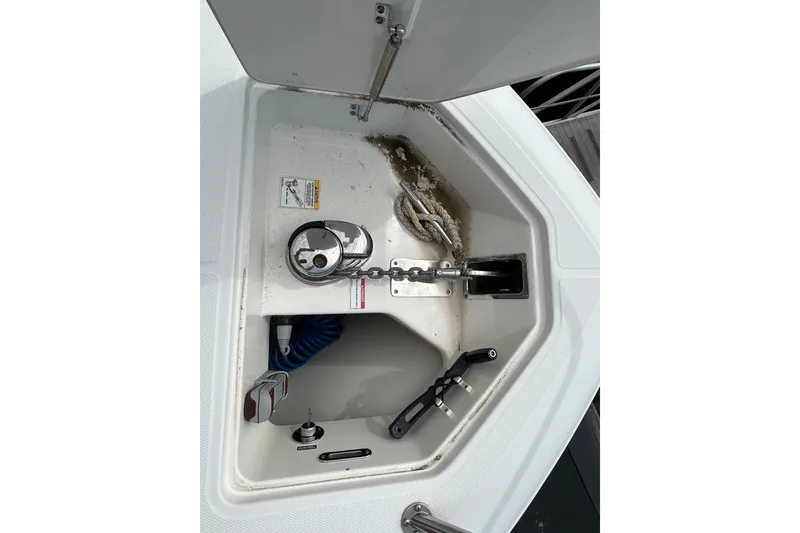 Slide: The Image of Anchor compartment of a 2020 Boston Whaler 280 Outrage, featuring chain and rope storage. - 22