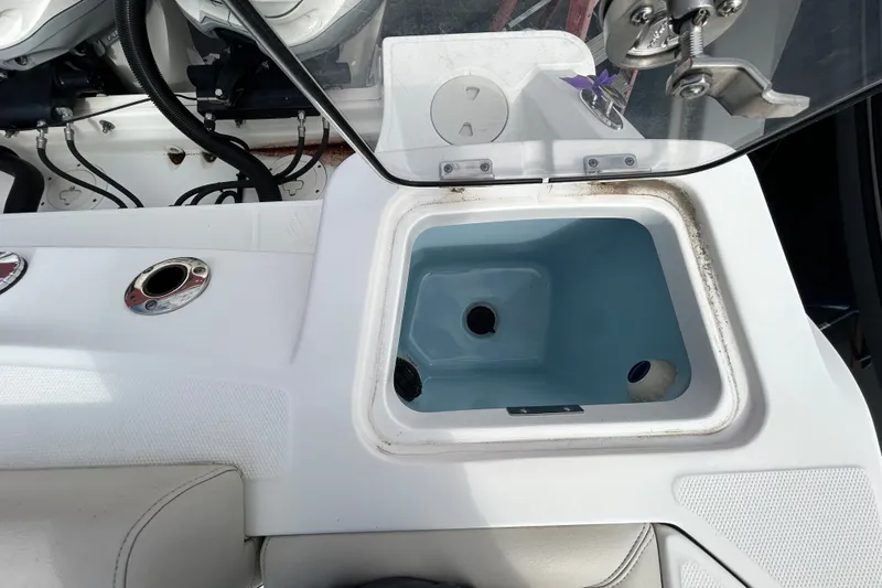 Slide: The Image of Livewell compartment on a 2020 Boston Whaler 280 Outrage boat, showcasing fishing amenities. - 23