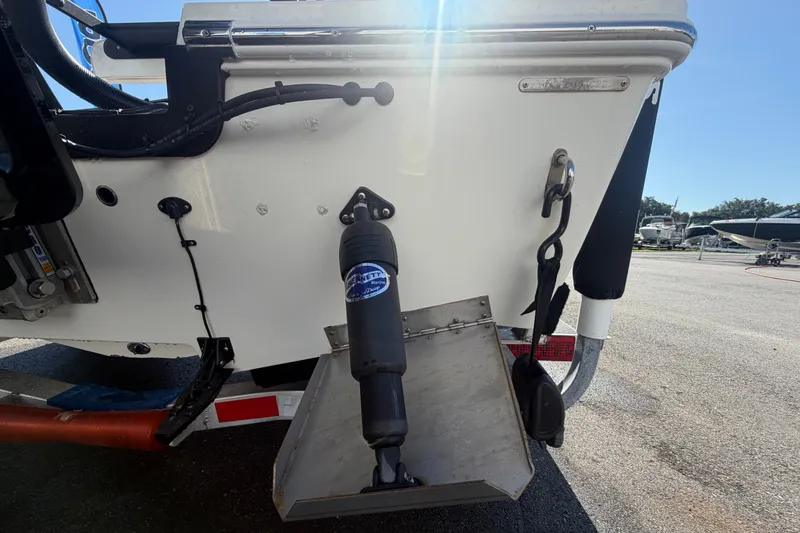 Slide: The Image of 2022 Hewes Redfisher 16 boat transom with trim tab and hydraulic components. - 5