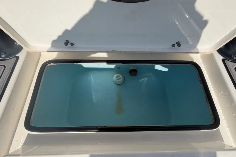 Slide: The Image of Livewell compartment of a 2022 Hewes Redfisher 16 boat, open and empty. - 53