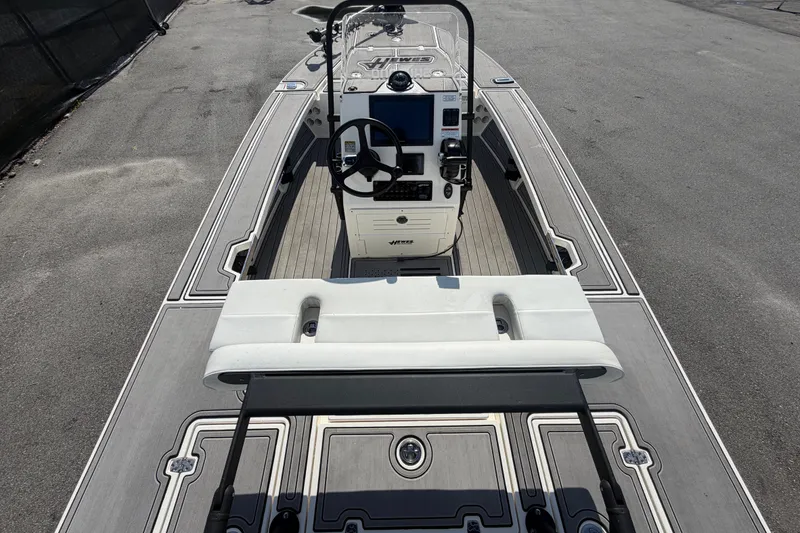 Slide: The Image of 2022 Hewes Redfisher 16 boat interior with steering console and seating. - 12