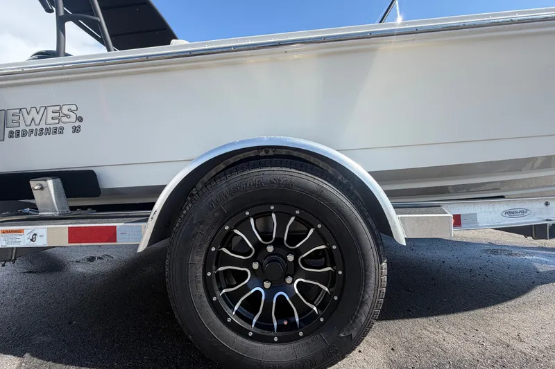 Slide: The Image of 2022 Hewes Redfisher 16 boat on trailer, featuring black alloy wheel. - 63