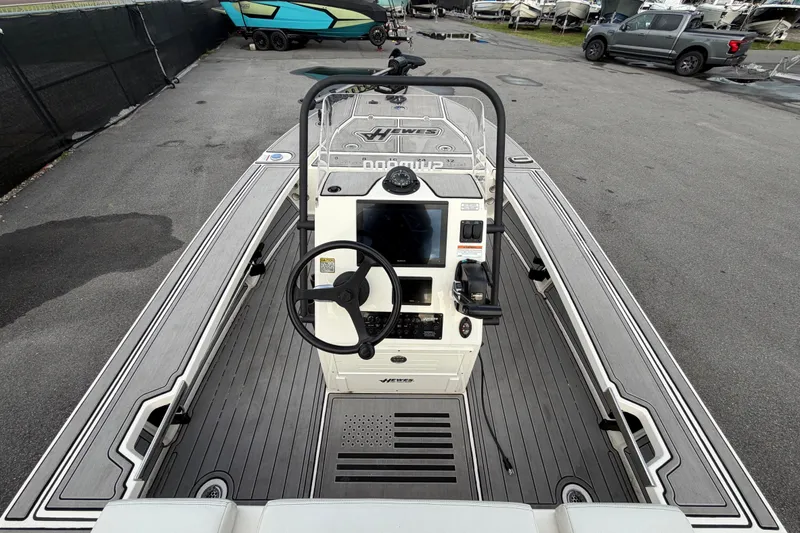 Slide: The Image of 2022 Hewes Redfisher 16 boat interior with steering wheel and control panel. - 7