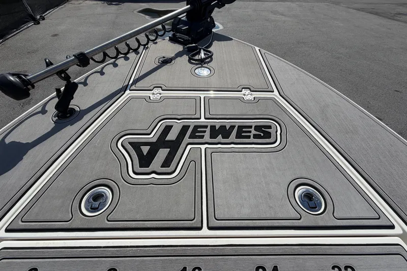 Slide: The Image of 2022 Hewes Redfisher 16 boat deck with logo and fishing equipment. - 30