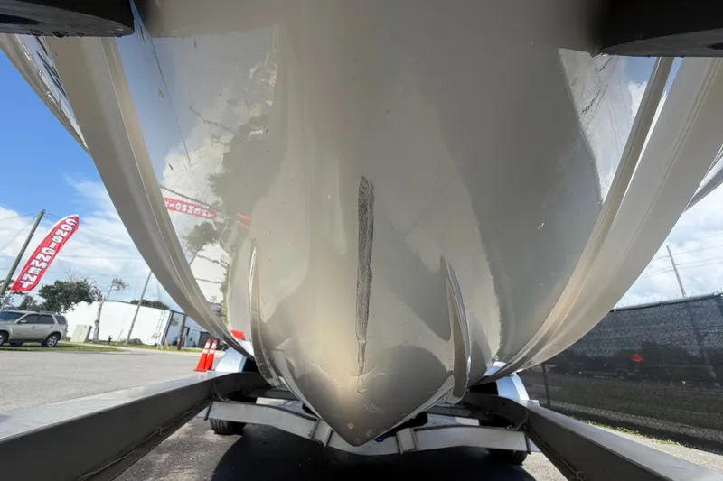 Slide: The Image of 2022 Hewes Redfisher 16 boat hull on trailer, viewed from below. - 11