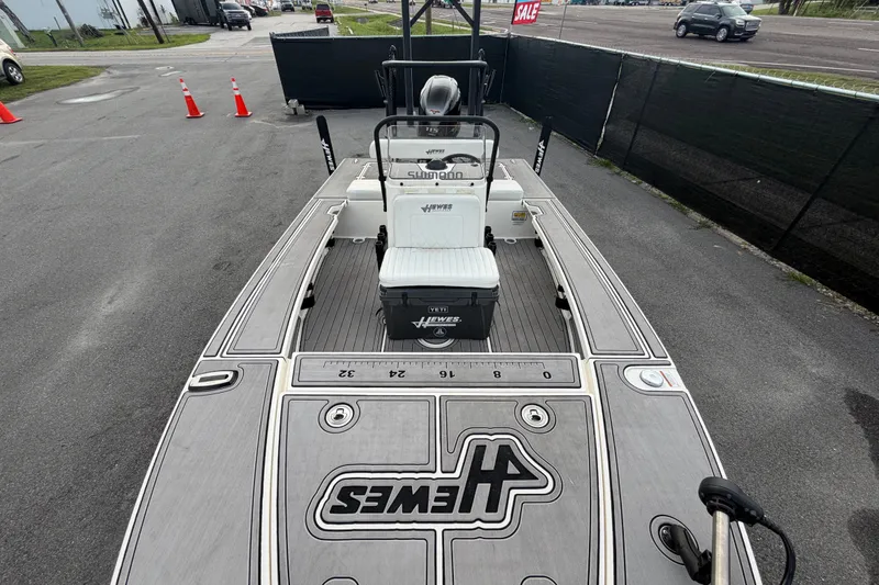 Slide: The Image of 2022 Hewes Redfisher 16 boat on display, featuring sleek deck design and sale sign. - 10