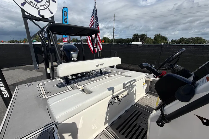 Slide: The Image of 2022 Hewes Redfisher 16 boat with American flag and Yamaha 115 engine. - 43