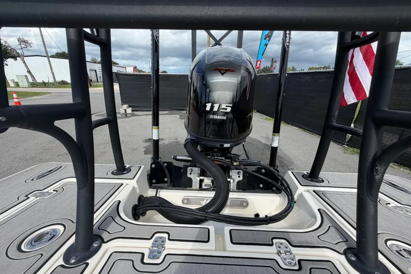 Slide: The Image of 2022 Hewes Redfisher 16 boat with Yamaha 115 engine, docked outdoors. - 56