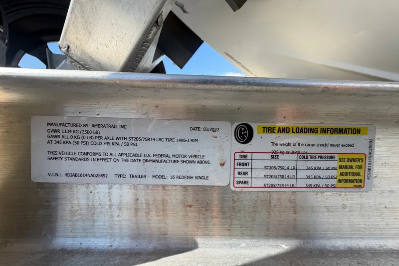 Slide: The Image of Label on Hewes Redfisher 16 trailer, detailing tire and loading information, manufactured by Ameratrail Inc. - 62
