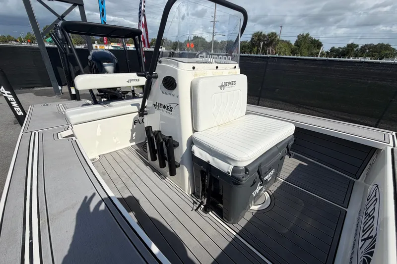 Slide: The Image of 2022 Hewes Redfisher 16 boat interior with seating and storage, displayed outdoors. - 40