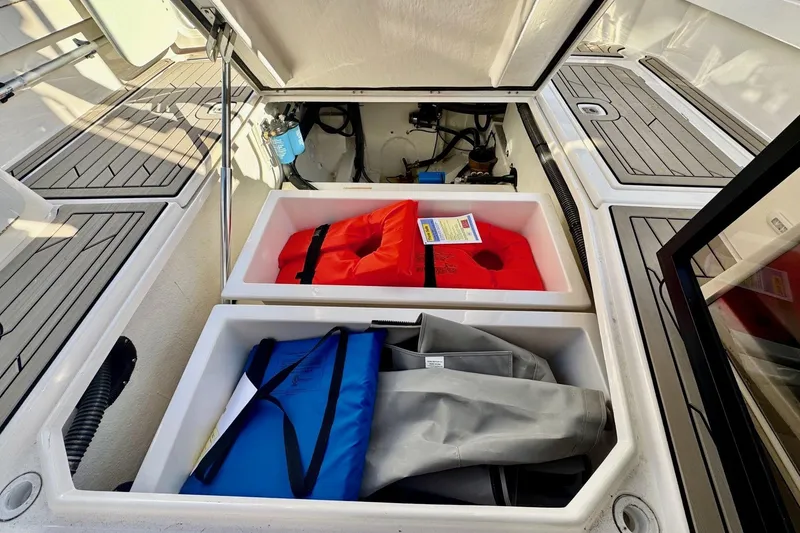 Slide: The Image of 2022 Cutwater C-32 CB boat storage with life jackets and equipment. - 29