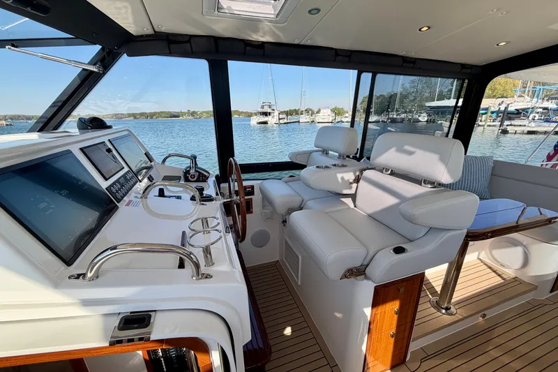 Slide: The Image of Luxurious interior of 2025 MJM 4 yacht with plush seating and modern controls. - 24
