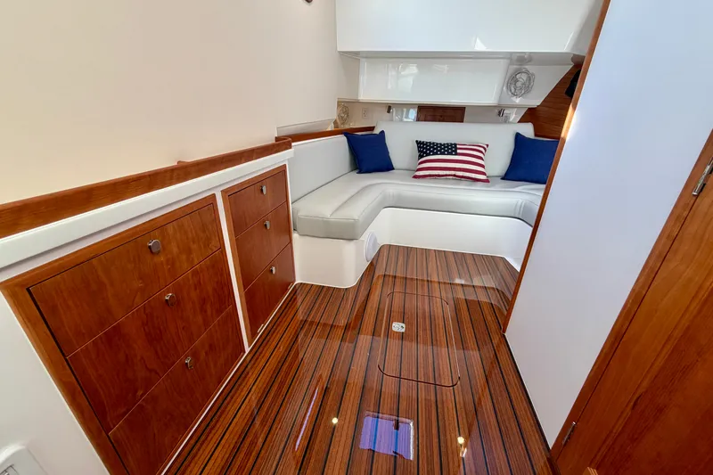 Slide: The Image of Luxurious 2025 MJM 4 yacht interior with elegant wood finish and cozy seating area. - 36
