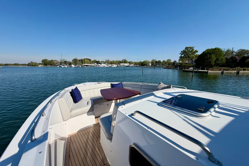 Slide: The Image of Luxury MJM 4 yacht, 2025 model, cruising on serene waters with elegant seating. - 29