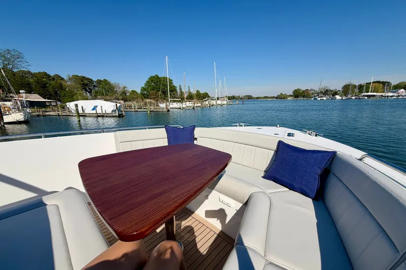 Slide: The Image of Luxury seating area on 2025 MJM 4 yacht with scenic marina view. - 31