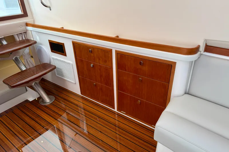 Slide: The Image of Luxurious interior of 2025 MJM 4 boat with wooden cabinetry and sleek design. - 37
