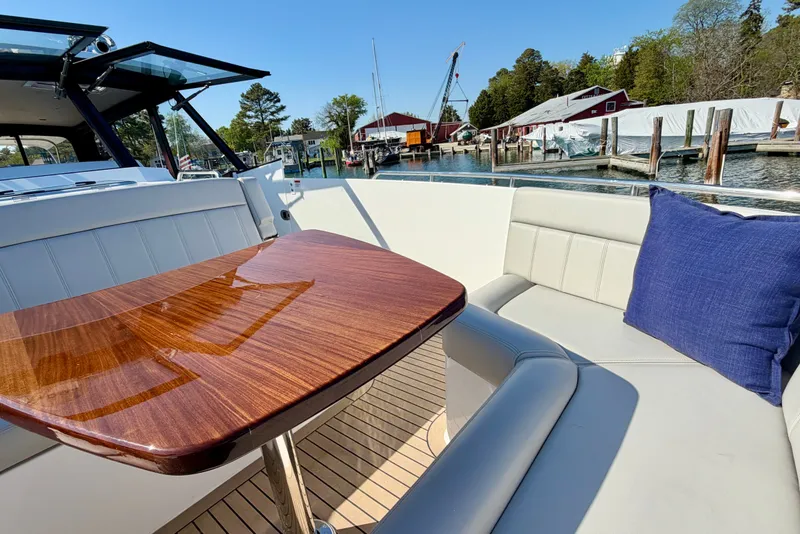 Slide: The Image of Luxurious 2025 MJM 4 yacht interior with elegant wood table and comfortable seating. - 32