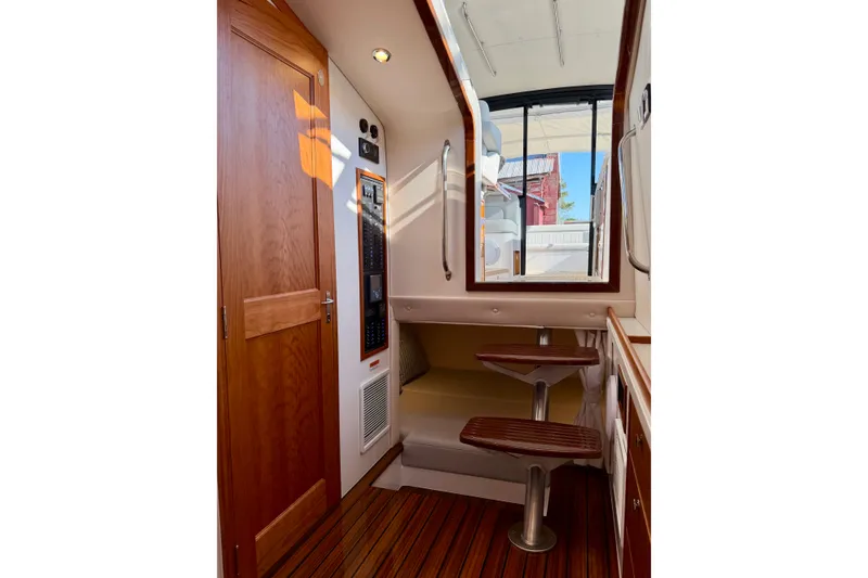 Slide: The Image of Interior of 2025 MJM 4 boat featuring wooden finishes and modern design elements. - 38