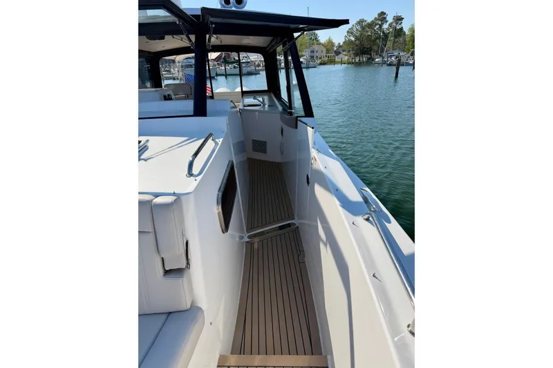Slide: The Image of 2025 MJM 4 boat deck with sleek design and waterfront view. - 28
