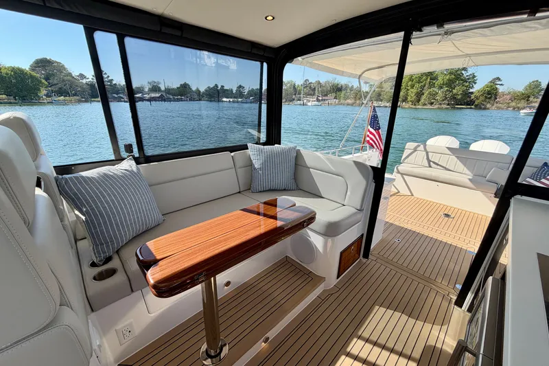 Slide: The Image of Luxurious 2025 MJM 4 yacht interior with elegant seating and scenic water view. - 21