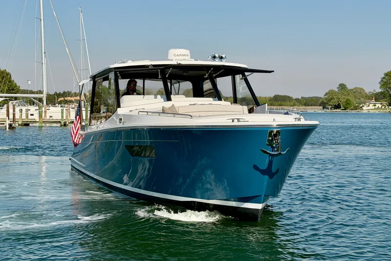 Slide: The Image of 2025 MJM 4 yacht cruising on a sunny day in a marina. - 15