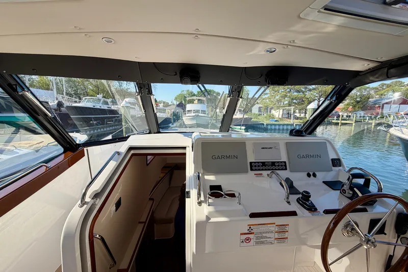 Slide: The Image of Interior view of 2025 MJM 4 boat cockpit with Garmin navigation systems. - 46