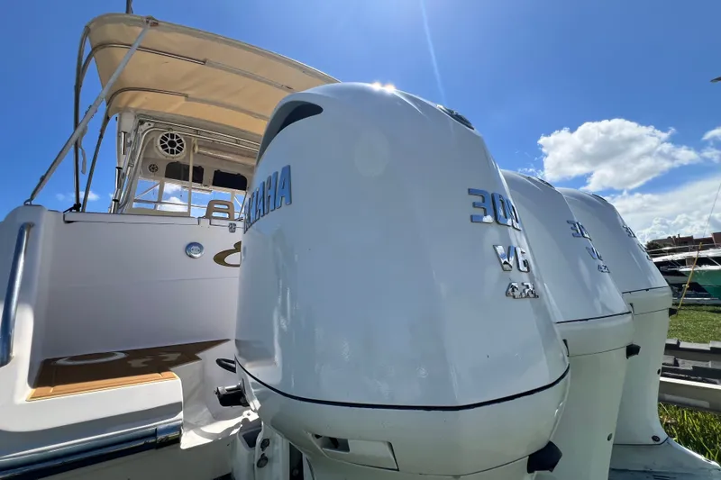 Slide: The Image of 2006 Grady-White Express 330 boat with Yamaha outboard engines under a clear blue sky. - 64