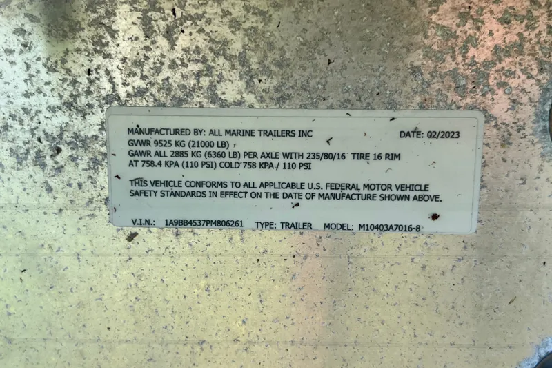Slide: The Image of Label on trailer manufactured by All Marine Trailers Inc, dated Q2/2023, with specifications. - 68