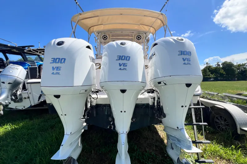 Slide: The Image of 2006 Grady-White Express 330 with triple Yamaha 300 V6 outboard engines. - 58