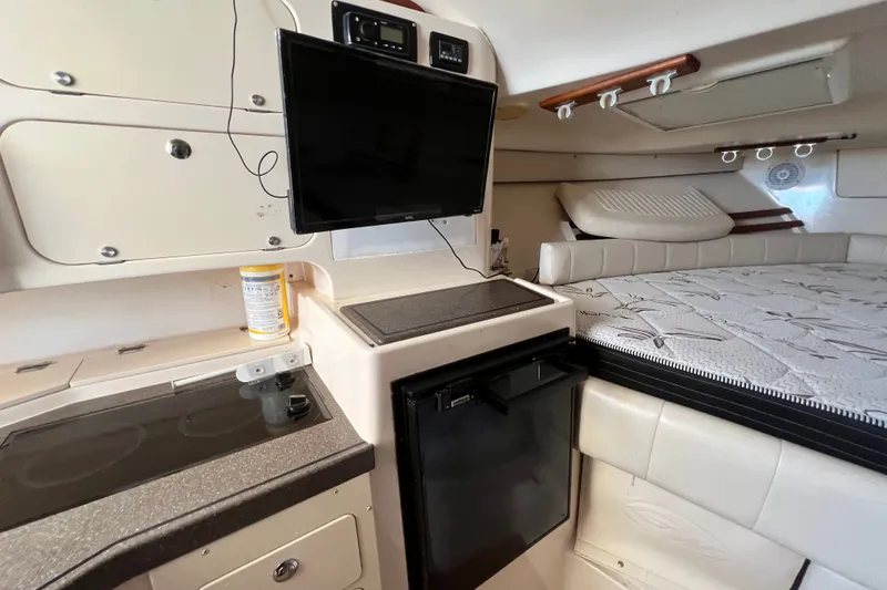 Slide: The Image of Interior of 2006 Grady-White Express 330 boat with kitchenette and bed. - 35