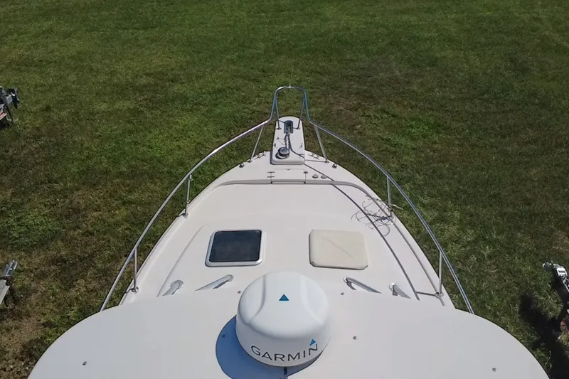 Slide: The Image of Top view of 2006 Grady-White Express 330 boat on grass, featuring Garmin equipment. - 11
