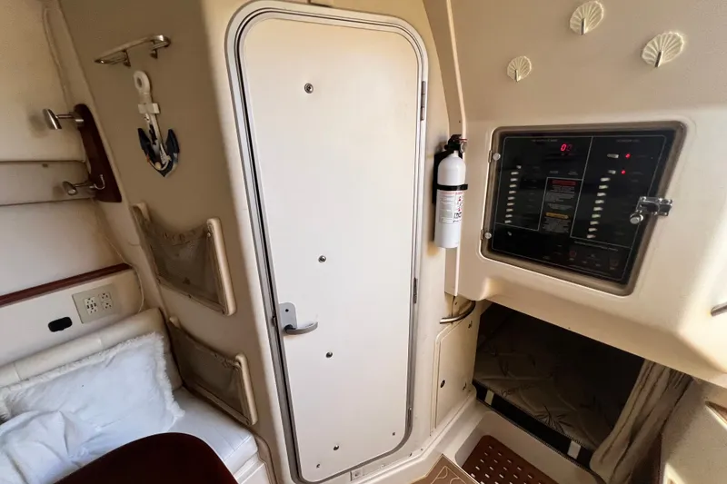 Slide: The Image of Interior of 2006 Grady-White Express 330 boat with control panel and cabin door. - 30