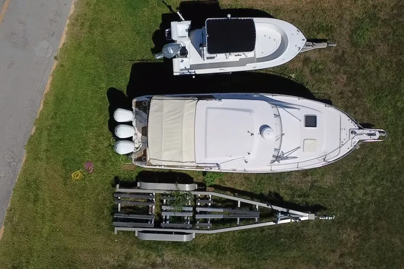 Slide: The Image of Aerial view of 2006 Grady-White Express 330 boat on grass with trailer. - 14