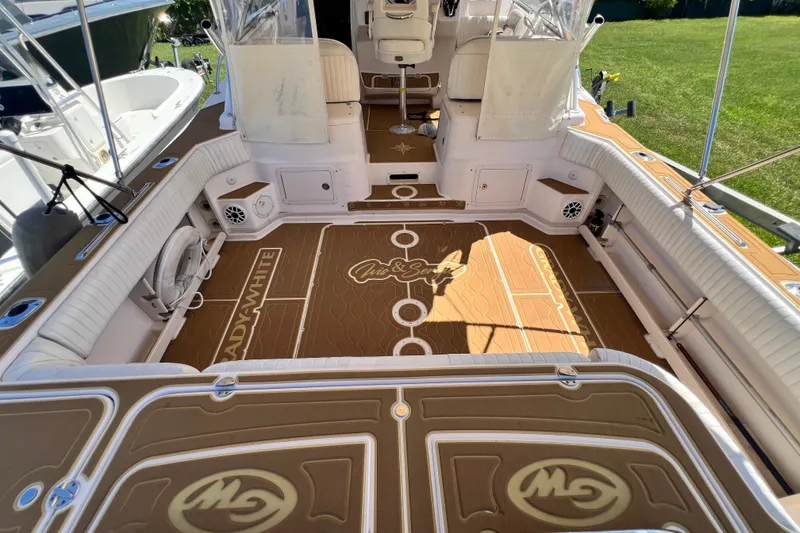 Slide: The Image of 2006 Grady-White Express 330 boat interior with custom flooring and seating. - 54