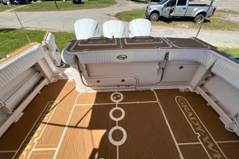 Slide: The Image of 2006 Grady-White Express 330 boat interior with cushioned seating and custom flooring. - 38