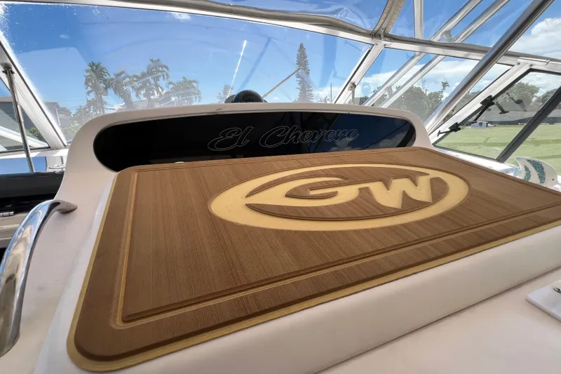 Slide: The Image of 2006 Grady-White Express 330 boat interior with "GW" logo and "El Chevere" text. - 24