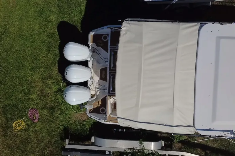 Slide: The Image of Aerial view of 2006 Grady-White Express 330 boat with triple outboard motors. - 15
