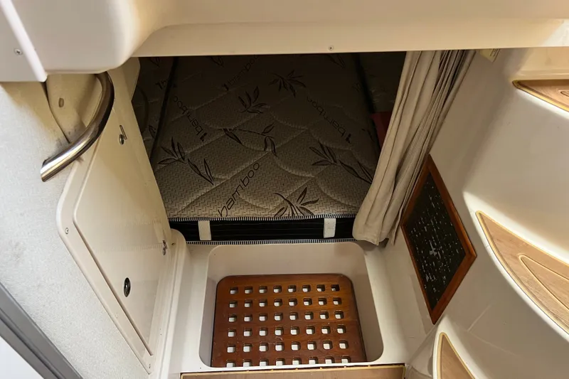 Slide: The Image of Interior cabin view of a 2006 Grady-White Express 330 boat with bamboo mattress. - 33
