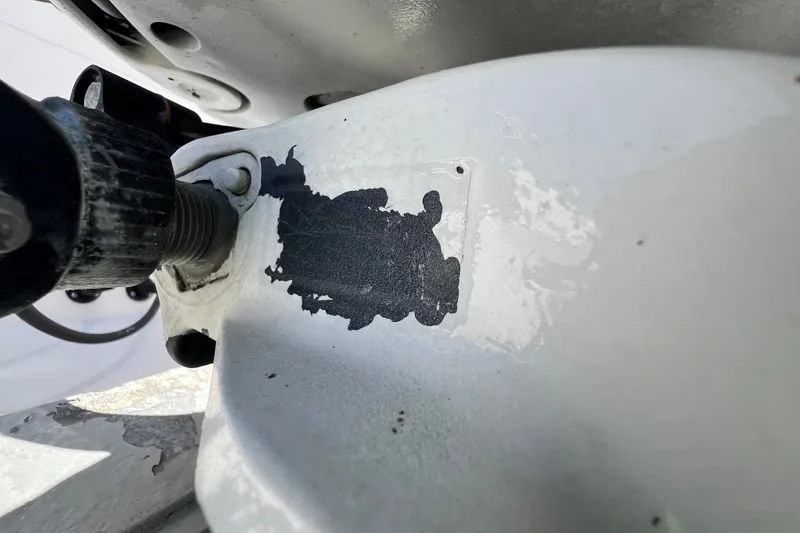 Slide: The Image of Close-up of a 2006 Grady-White Express 330 boat component with paint damage. - 63